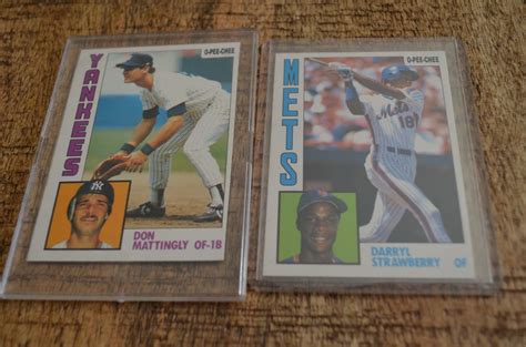 Professionally graded cards will sell for more. Darryl Strawberry & Don Mattingly Rookie Cards