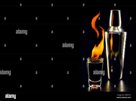 Burning Alcoholic Drinks With Big Flame On Black Background With Copy