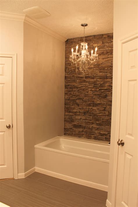 Scroll up or down to compare our cultured marble colors. My tub with faux stone wall accent wall and chandelier. | House bathroom, Faux stone walls ...