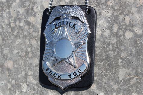 funny police badge with leather backing and chain by semifold