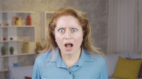 Mature Woman Is Surprised Sympathetic Mature Woman Looks At Camera And