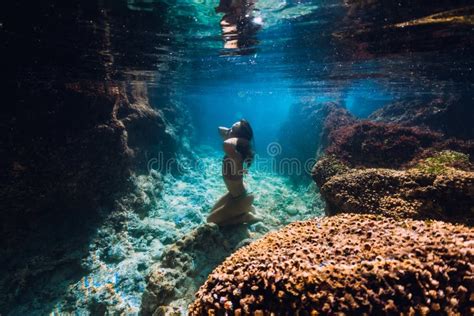 Woman In Bikini Posing Underwater Near Corals In Blue Ocean Stock Image Image Of Lifestyle