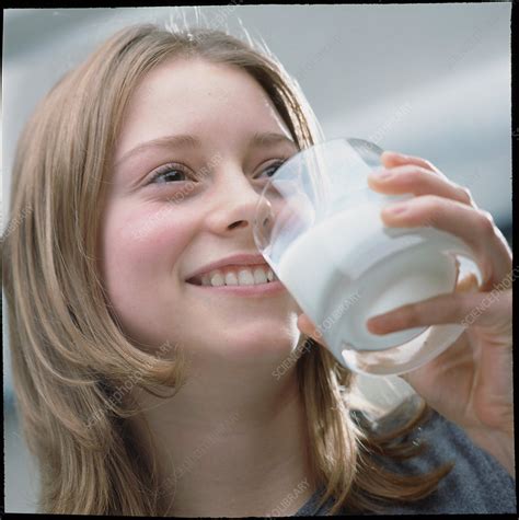 Teenage Girl Drinking A Glass Of Milk Stock Image P