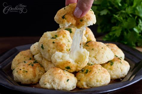 Flatten each biscuit place 1 piece of cheese in middle and wrap biscuit dough around it. Garlic Cheese Bombs :: Home Cooking Adventure