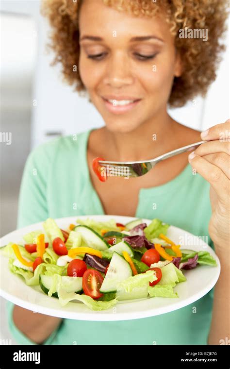 Mid Adult Woman Eating A Healthy Salad Stock Photo Alamy