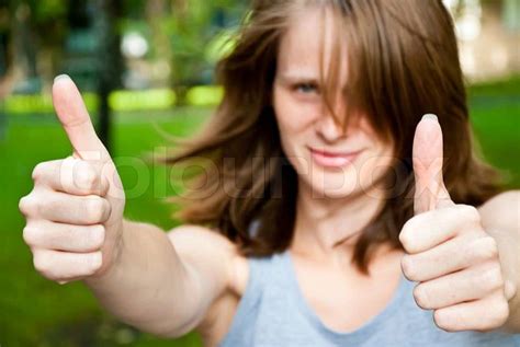 Beautiful Woman Showing Two Thumbs Up Stock Photo Colourbox