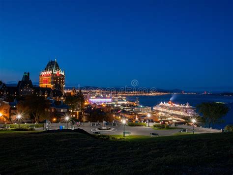 Night View Of The Famous Fairmont Le Château Frontenac Cityscape And Queen Mary 2 Stock Image