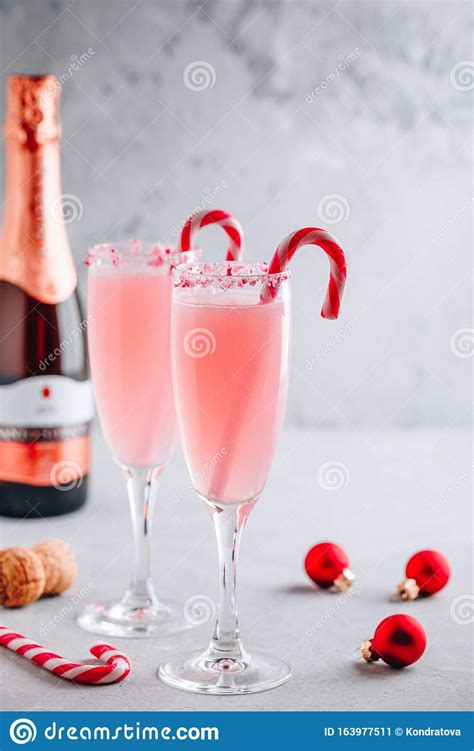 Keep guests' glasses topped up with everything from traditional mulled wine to easy serve a classic snowball at christmas for your guests. Festive Christmas Drink Peppermint Bark Mimosa Cocktail With Champagne Or Prosecco And Candy ...