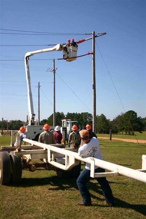 Utility Lineman Technology Students Working From A Bucket Truck
