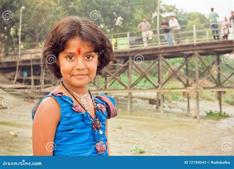 Girl With Beautiful Eyes And Tilak Sign Playing In Indian Village