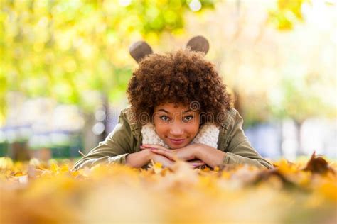 Autumn Outdoor Portrait Of Beautiful African American Young Woman Lying