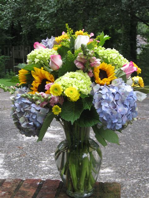 sunflowers and hydrangeas with pink rose and snapdragon accents flower arrangements wedding