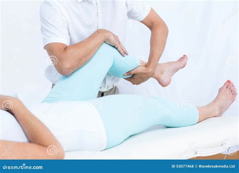 Physiotherapist Doing Leg Massage To His Patient Stock Photo Image Of