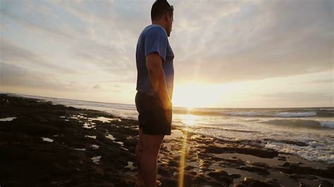 Man On Beach Looking At Beautiful Sunset Stock Footage Sbv 313238621