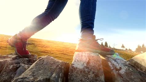 Close Up Of Hiker Feet Walking Over Rocky Stone Terrain Hiking