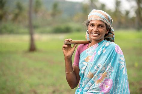Indian Farmer Women On Farm Field With Happy Face Stock Photo