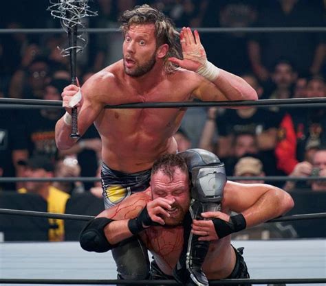 Kenny Omega Beats Jon Moxley In A Brutal Bloody Exploding Barbed Wire