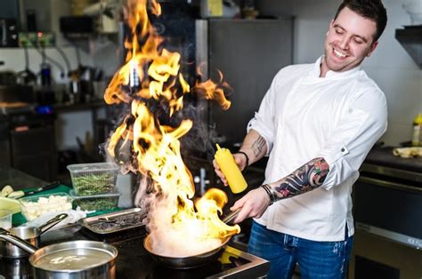 Premium Photo Chef Is Making Flambe In A Restaurant Kitchen