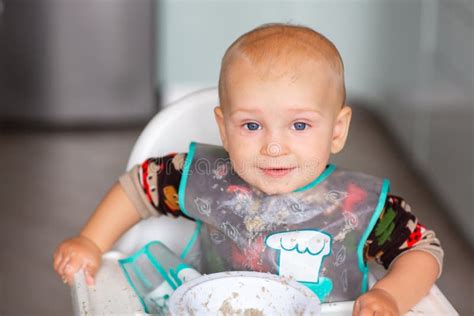 Cute Little Baby Eating His First Porridge Stock Photo Image Of