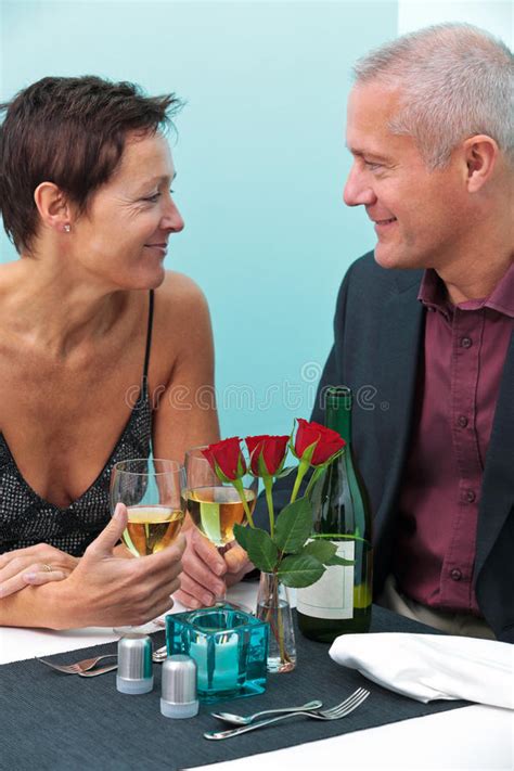 Married Couple Sharing Food In A Restaurant Stock Image