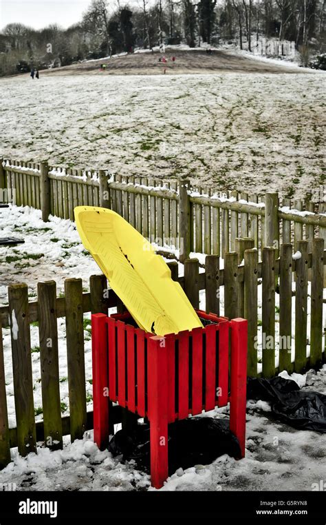 A Broken Sledge Sits Discarded In A Rubbish Bin In Arnos Park Bristol The Hill Muddy After The