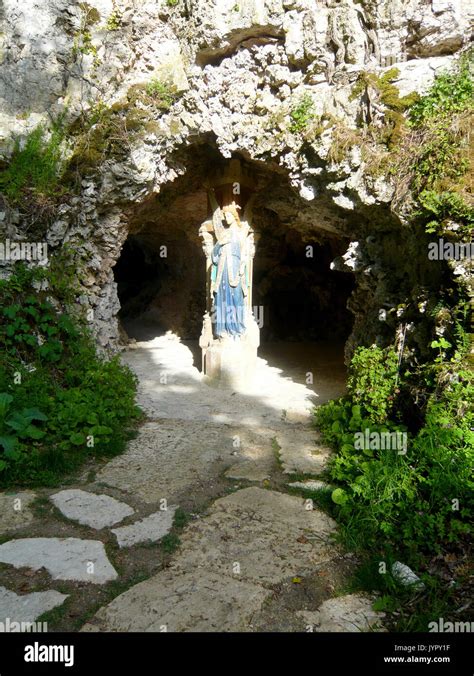 Religious Grotto With Statue Of Angel Inside Stock Photo Alamy