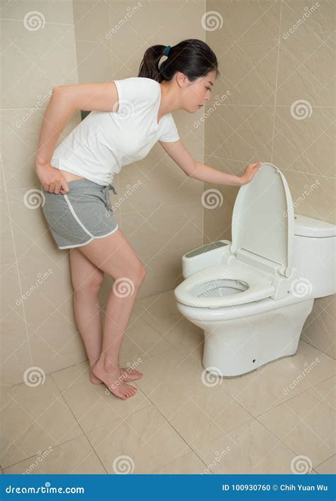 Lovely Woman Opening Toilet Lid And Holding Pant Stock Photo Image Of Model Restroom