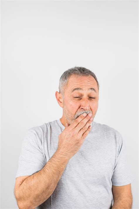 Free Photo Aged Man Yawning Covering His Mouth