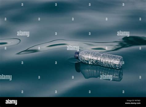 Plastic Water Bottle Floating On Water Surface Stock Photo Alamy