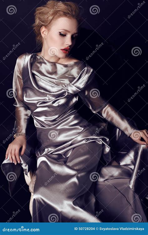 Beautiful Sensual Woman With Dark Hair Wearing Elegant Dress And Bijou