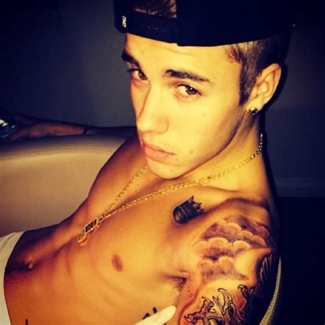 justin bieber shows off new tattoo in shirtless photos tries to look semi hard the hollywood