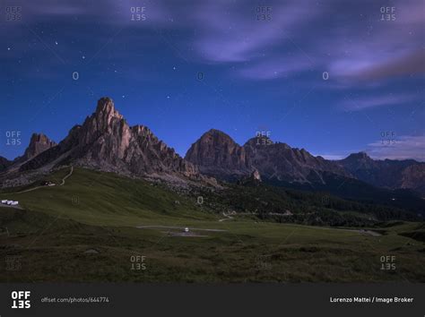 Gusela Mountain In A Starry Night With Clouds Giau Pass Dolomites