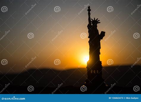 Statue Of Liberty On The Background Of Colorful Dawn Sky Stock Image