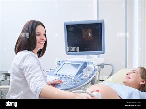 Pregnant Woman Having Ultrasonic Scanning At The Clinic Stock Photo Alamy