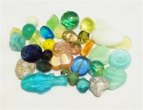File:Uranium glass beads, white background.jpg - Wikimedia Commons