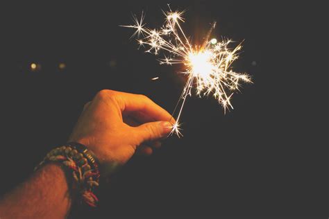 Photo Of A Person Holding A Sparkler Pixeor Large Collection Of