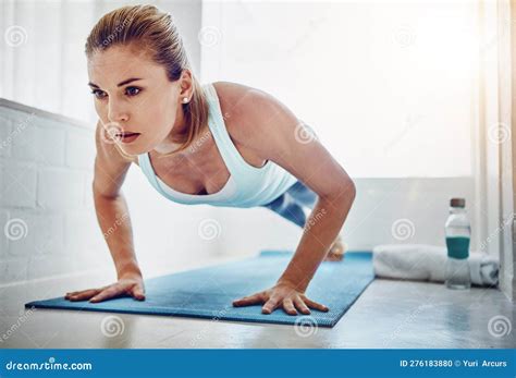 Im In It For A Healthier Me A Woman Doing Push Ups On Her Yoga Mat