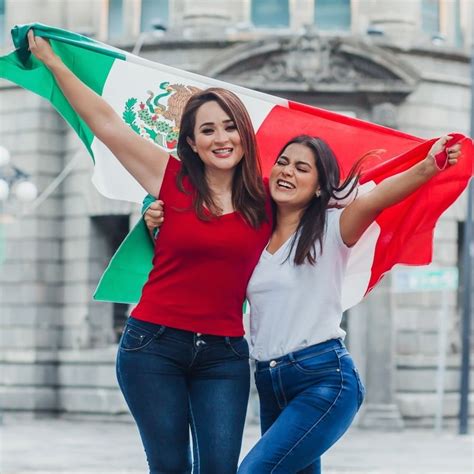 Two Young Women Possibly Mexican Holding Up A Mexican Flag In Mexico City Mexico Travel Off Path