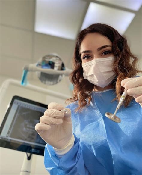 Female Dentist Examining Patient With Dental Equipment Dental Artofit