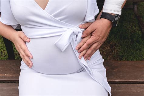 An Anonymous Man Holds His 4 Month Pregnant Wifes Belly Excited About