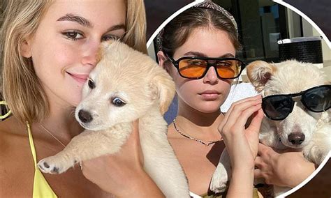 Kaia Gerber Cuddles Up To Her Rescue Pup As She Lounges By The Pool In