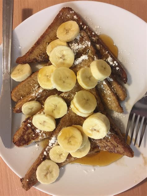 Homemade French Toast With Bananas Powdered Sugar And Real Maple