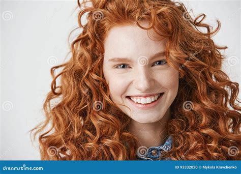 Close Up Of Redhead Beautiful Girl With Freckles Smiling Looking At