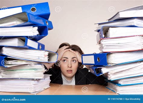 Businesswoman With A Lot Of Folders On The Table Stock Photo Image Of