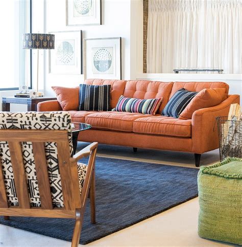 Fun And Cheerful Modern Living Room With Orange Tufted Sofa White