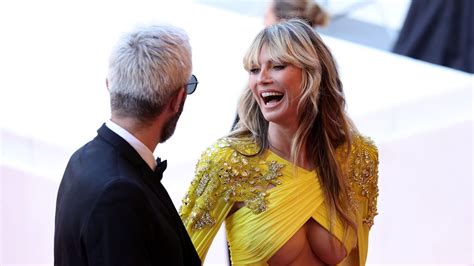 heidi klum 49 steals the limelight as she suffers wardrobe malfunction in plunging yellow gown