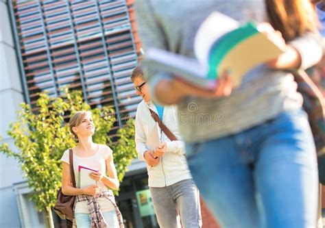 Happy Friends Talking While Talking At Campus Stock Photo Image Of
