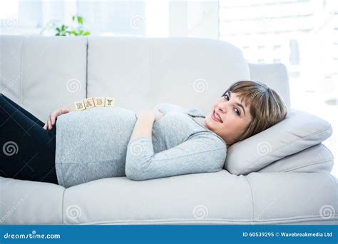 Portrait Of Pregnant Woman Playing With Wooden Blocks Stock Image