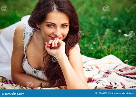 Happy Smiling Woman With Happy Look Lying On The Green Summer Grass Closeup Stock Image Image