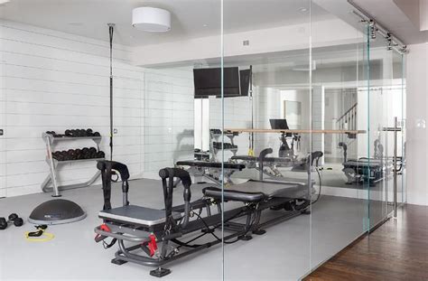Behind A Seamless Glass Wall Fitted With A Glass Door This Home Gym